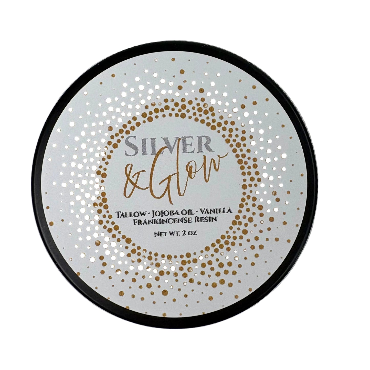 Round product label for Silver & Glow balm. The label features a white background with a gold dotted circular pattern. Text reads: ‘Silver & Glow. Tallow, Jojoba Oil, Vanilla, Frankincense Resin. Net Wt. 2 oz.