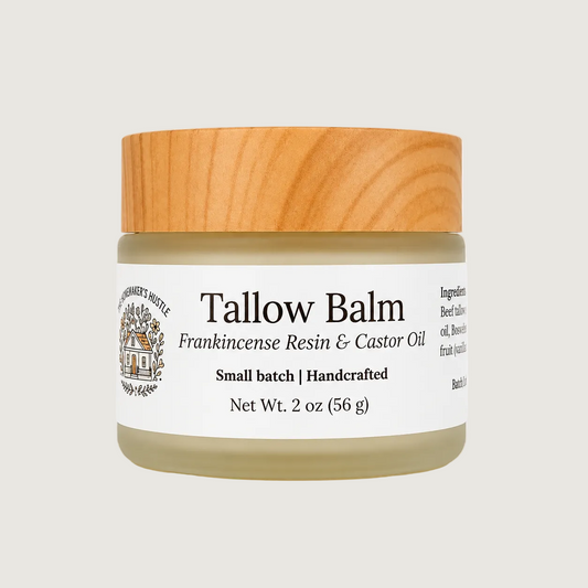 Tallow balm jar with wooden lid on a white background