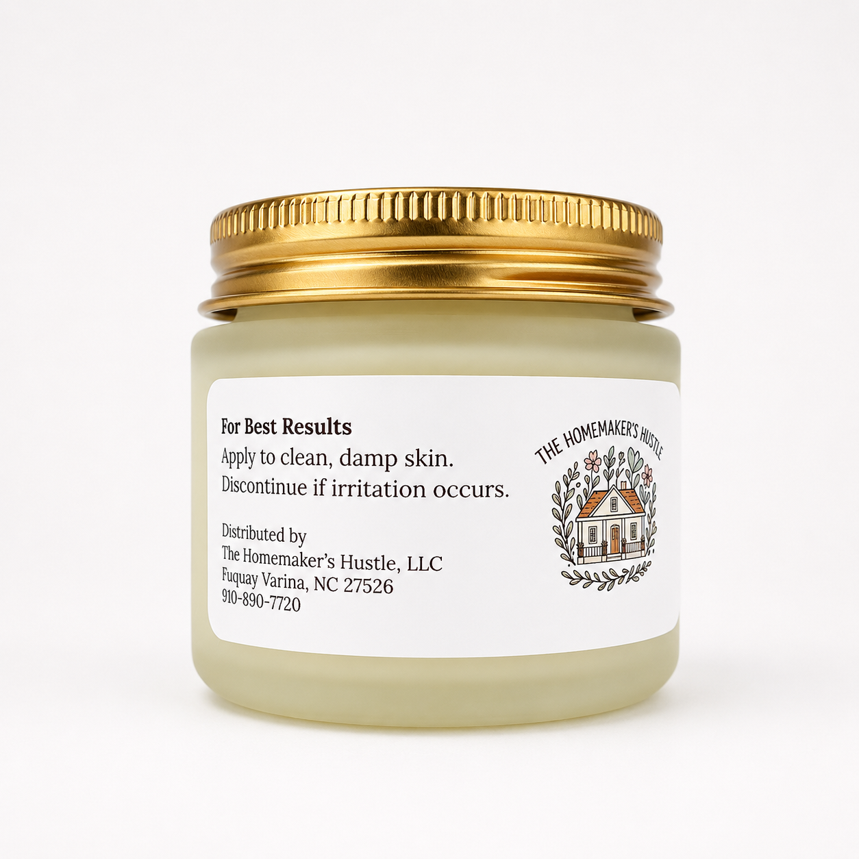 Jar of cream with a gold lid on a white background